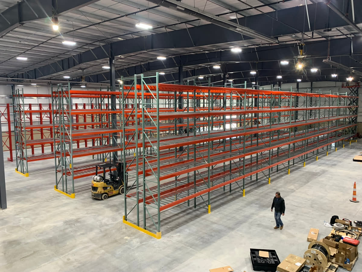 Warehouse pallet racking aisles with a forklift