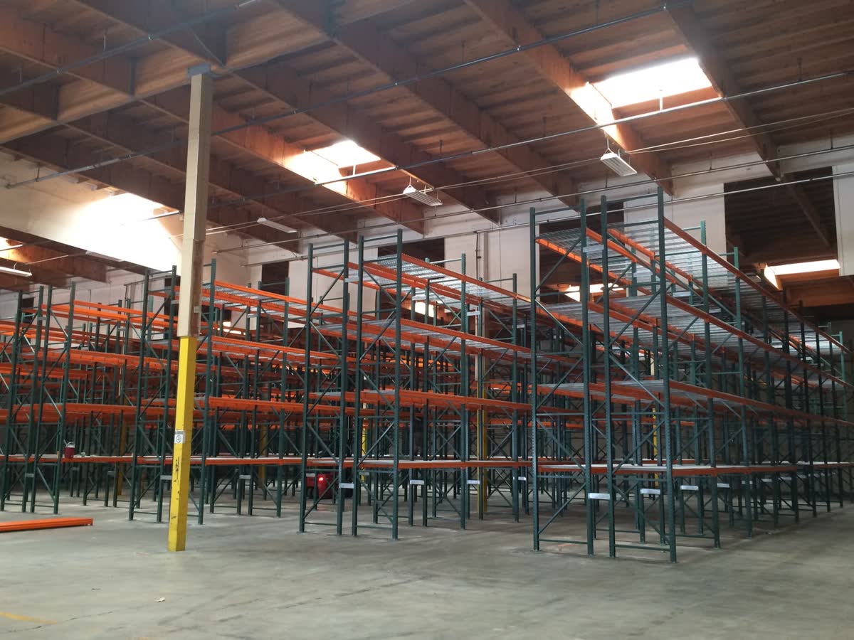 Pallet racking rows under warehouse skylights
